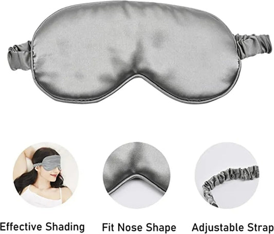 Gray sleep mask with features highlighted on a white background