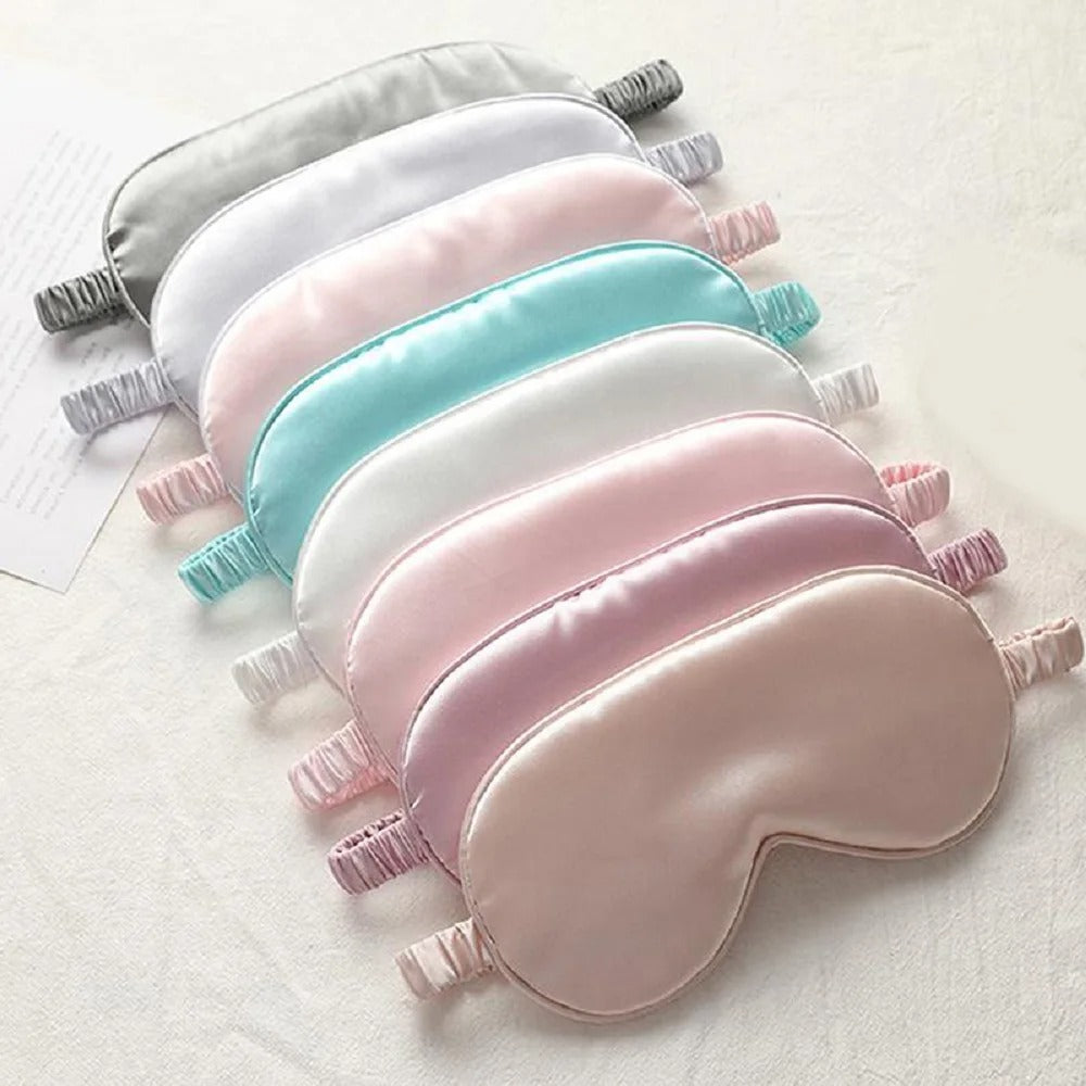 Set of pastel-colored eye masks on a light background